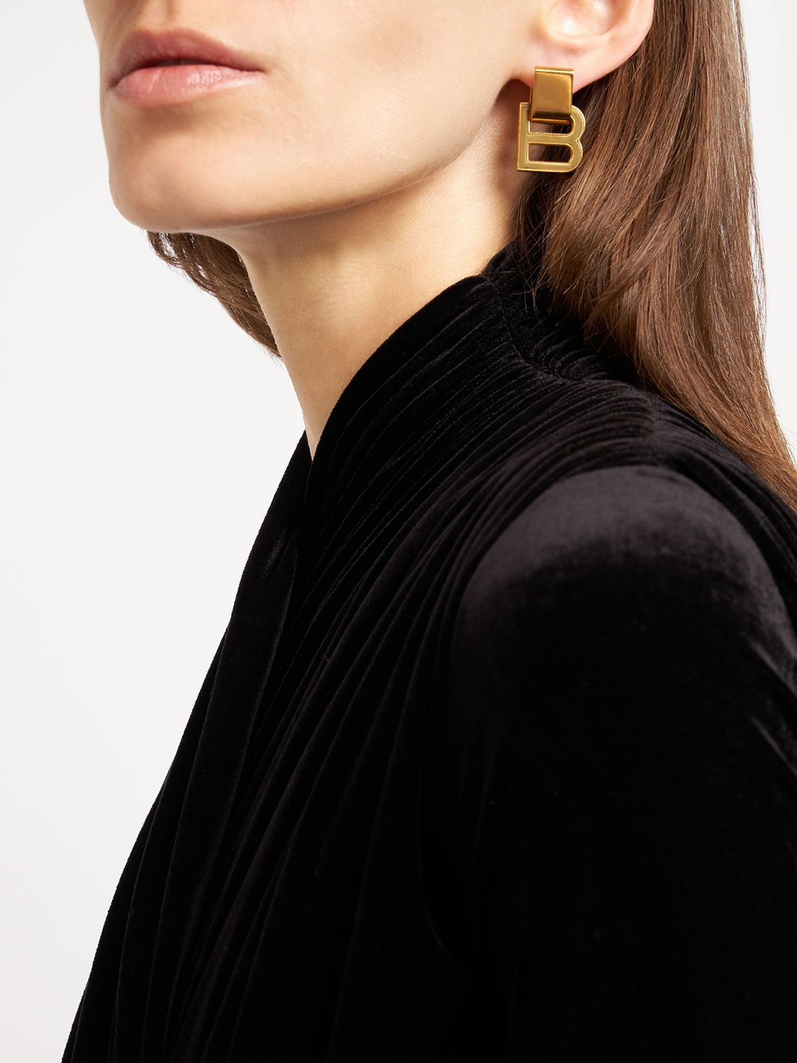 Shop Balenciaga Hourglass Brass Earrings In Gold