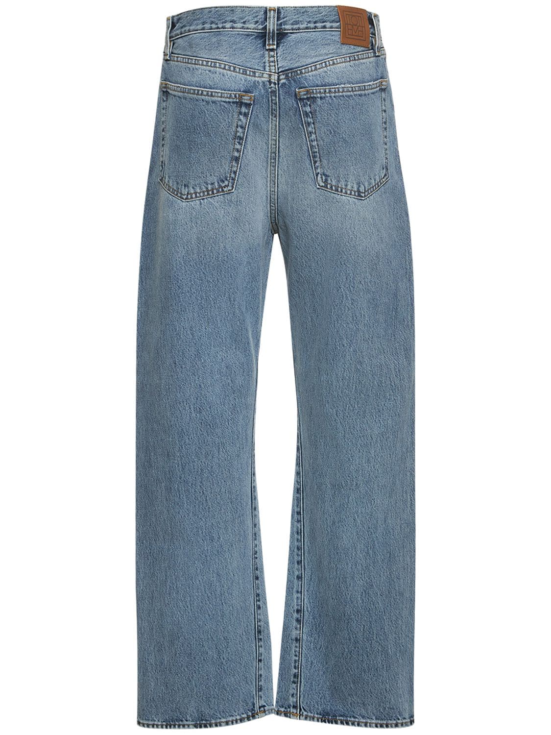 Shop Totême Twisted Seam Full Length Denim Jeans In Blue