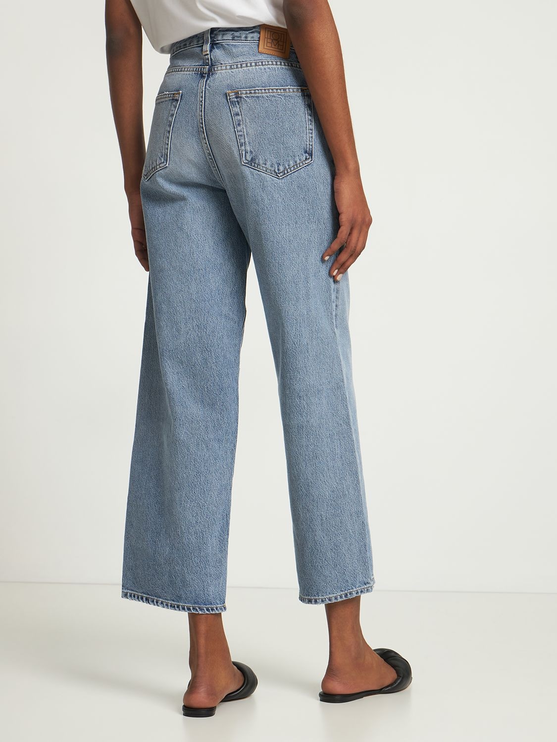 Shop Totême Organic Cotton Denim Flared Jeans In Blue