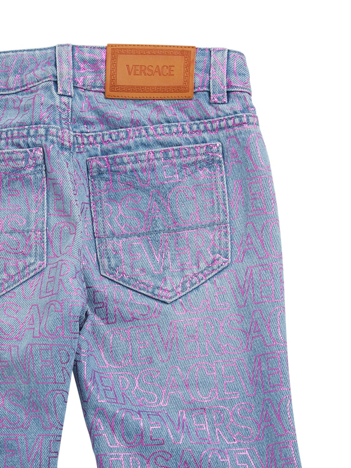 Shop Versace All Over Logo Print Cotton Denim Jeans