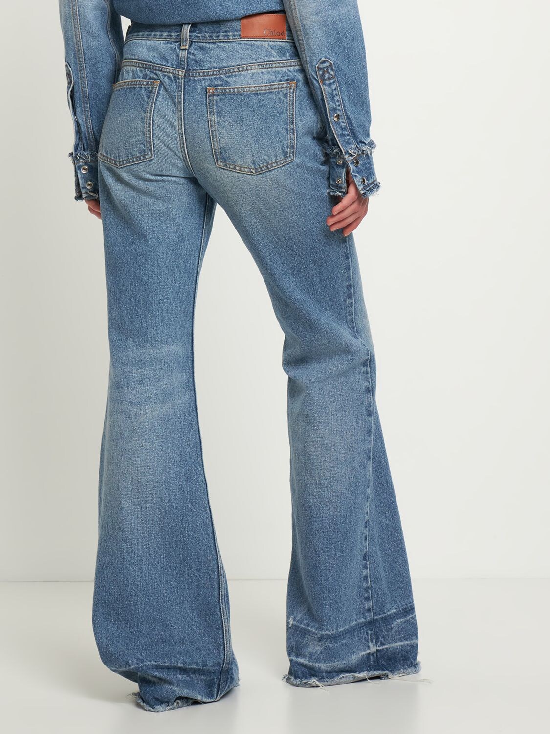 Shop Chloé Low Rise Flared Denim Jeans In Blue