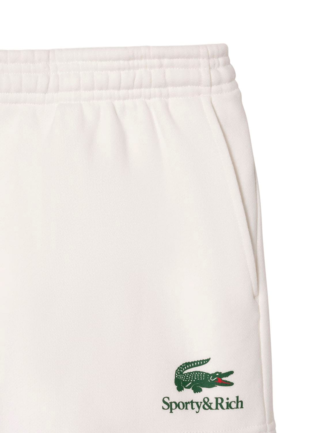 Shop Sporty And Rich Lacoste Serif Disco Shorts In Beige