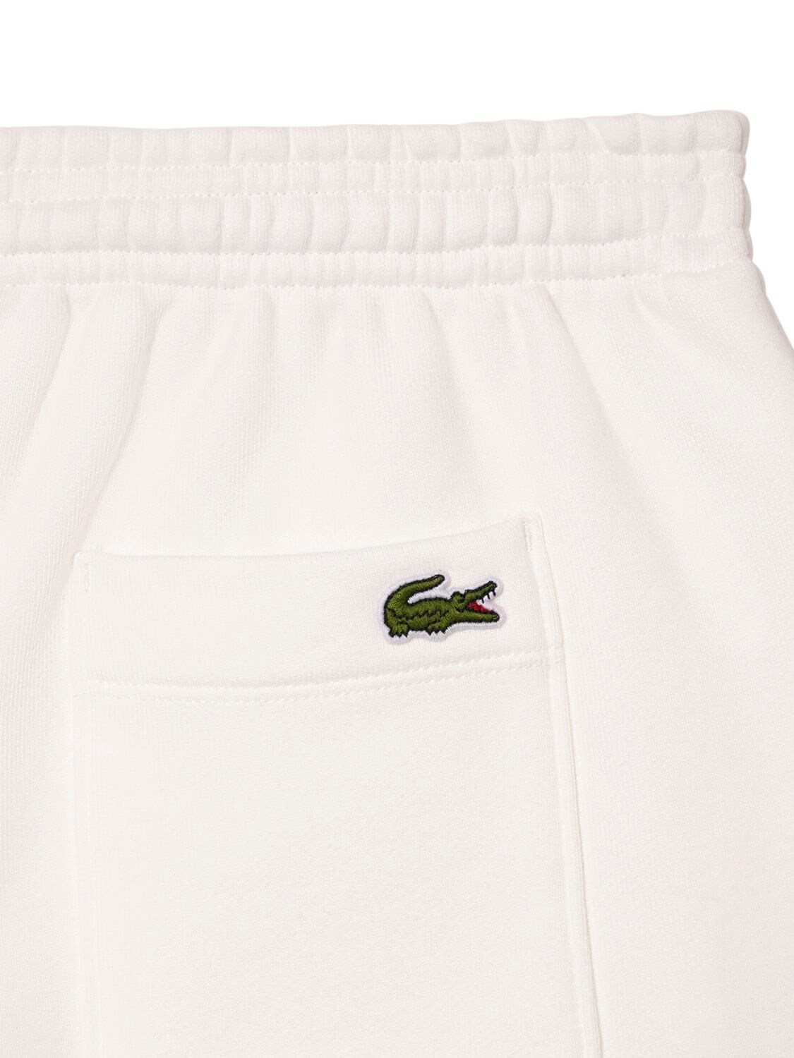 Shop Sporty And Rich Lacoste Serif Disco Shorts In Beige