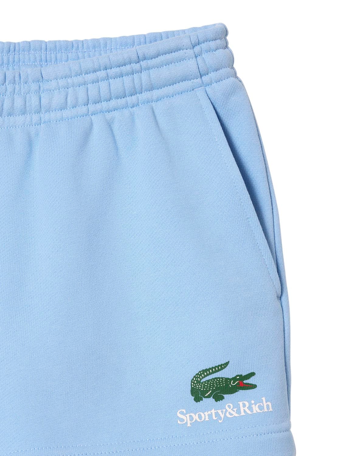 Shop Sporty And Rich Lacoste Serif Disco Shorts In Light Blue