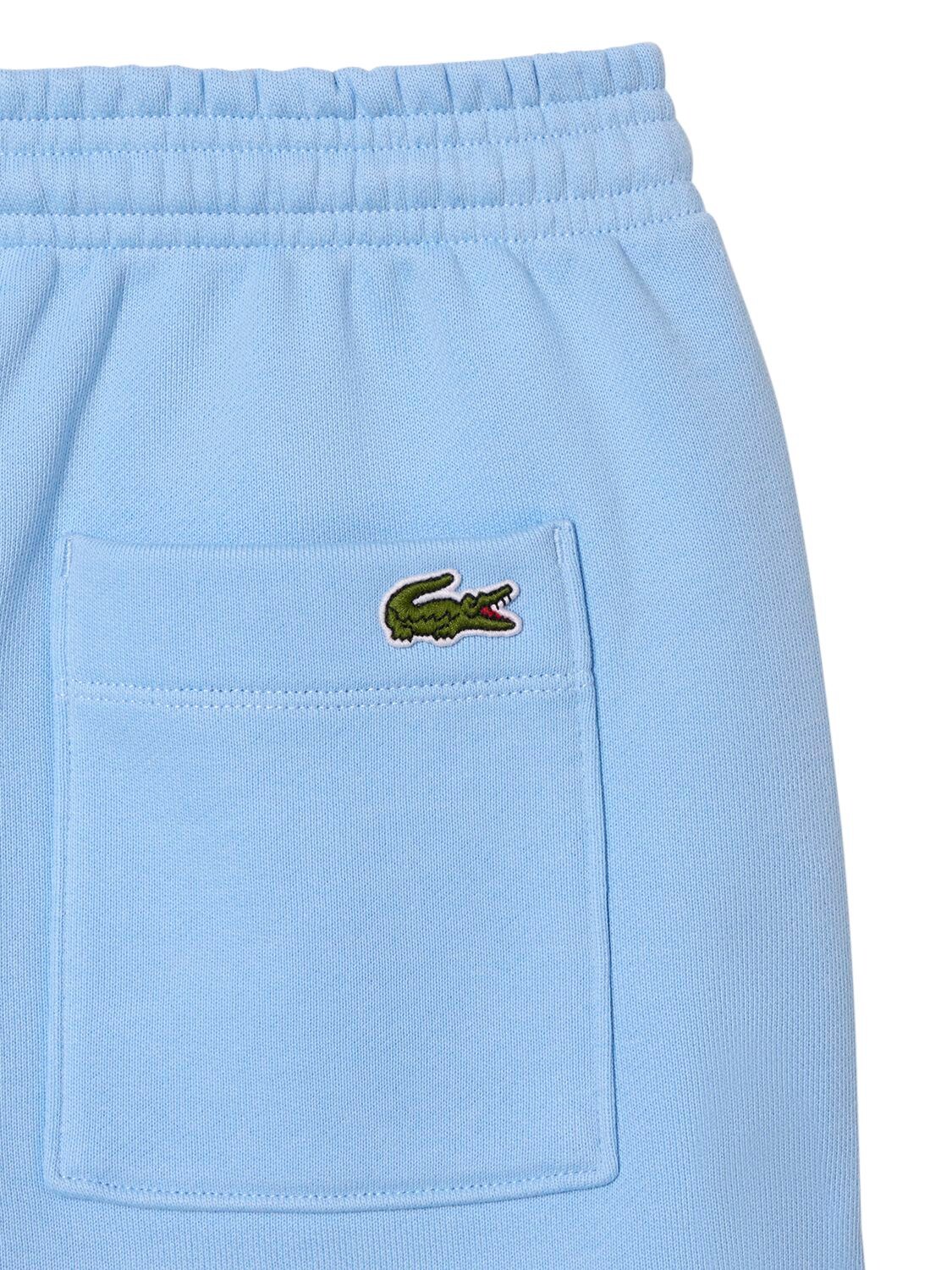 Shop Sporty And Rich Lacoste Serif Disco Shorts In Light Blue