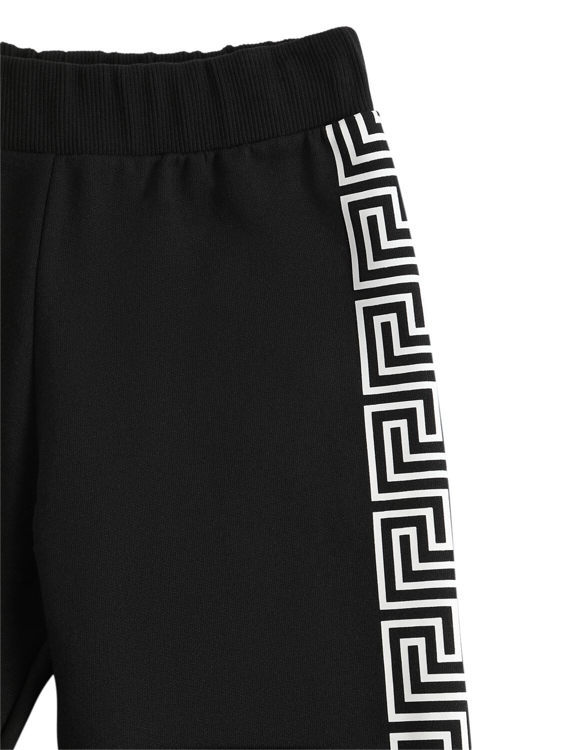 Shop Versace Greca Print Cotton Sweatpants In Black