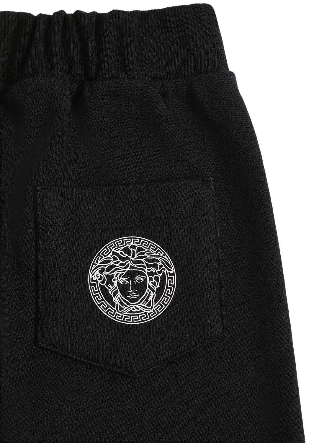 Shop Versace Greca Print Cotton Sweatpants In Black