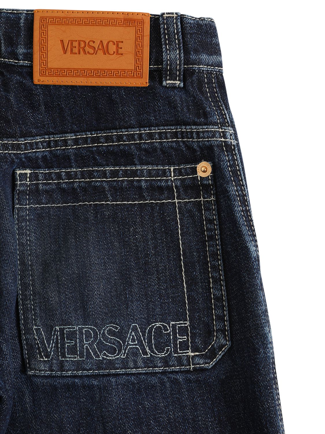 Shop Versace Stonewashed Cotton Denim Jeans