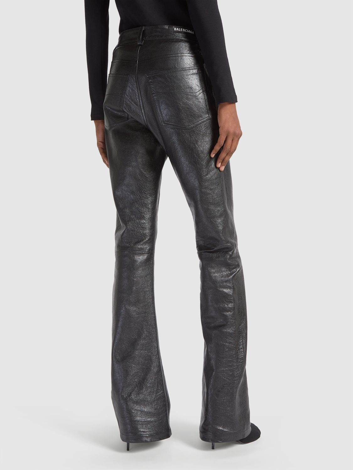 Shop Balenciaga Semi Shiny Leather Bootcut Pants In Black