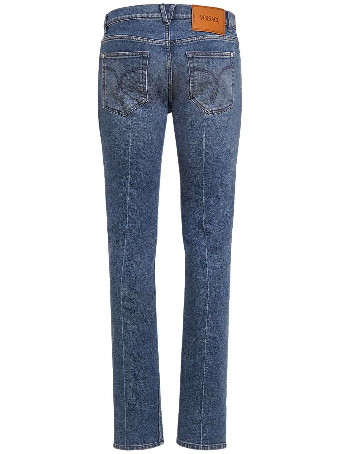 Shop Versace Stonewashed Cotton Denim Jeans In Blue
