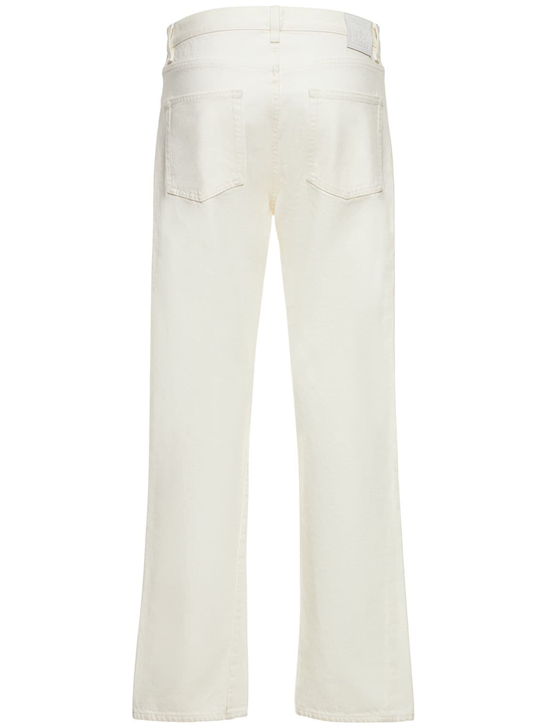 Shop Totême Twisted Seam Organic Cotton Jeans In White