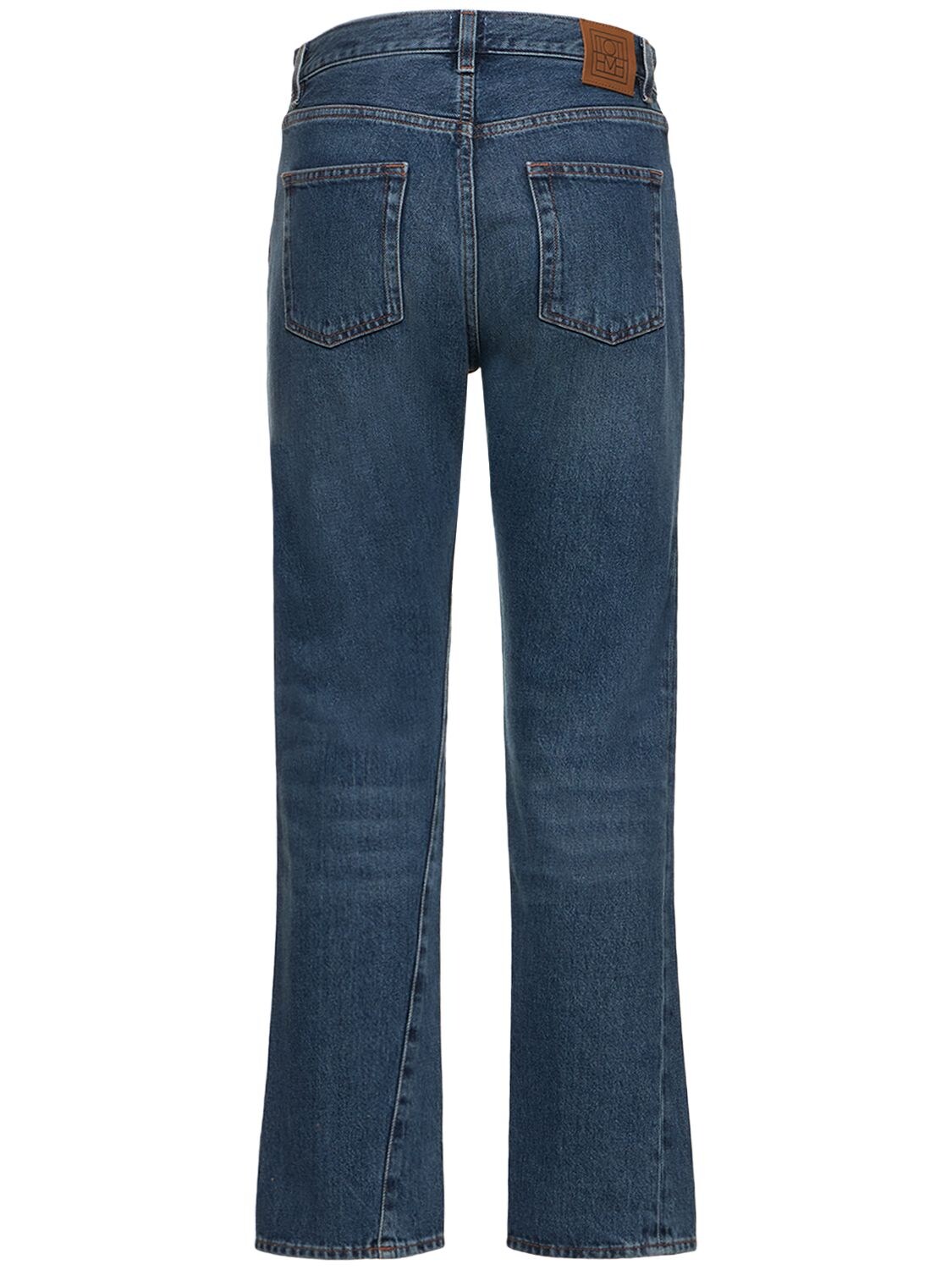 Shop Totême Twisted Seam Cotton Denim Jeans In Blue