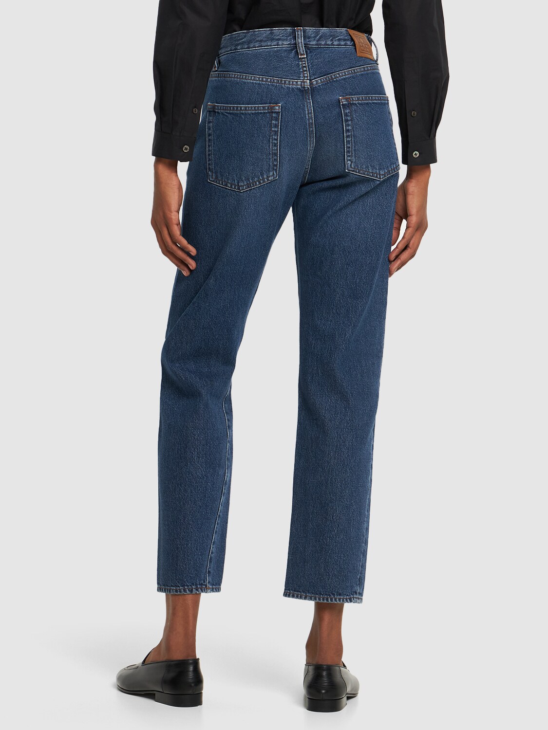 Shop Totême Twisted Seam Cotton Denim Jeans In Blue