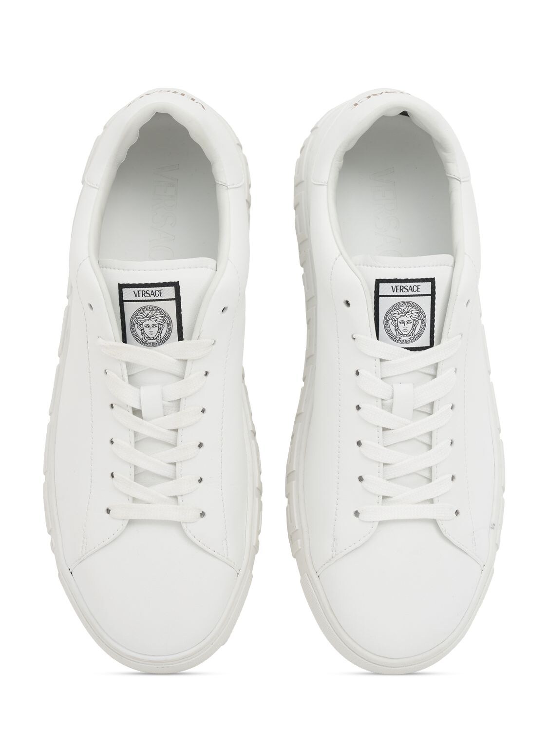 Shop Versace Responsible Sneakers In White