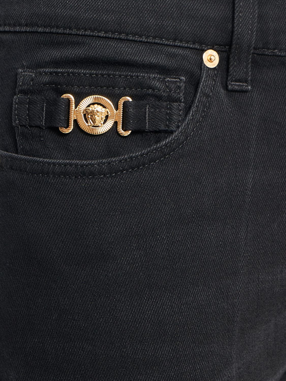 Shop Versace Stonewashed Cotton Denim Jeans In Washed Black